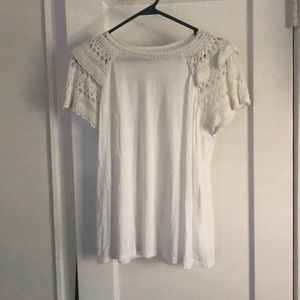 Loft knit shirt with lace detail on neck and sleeve.